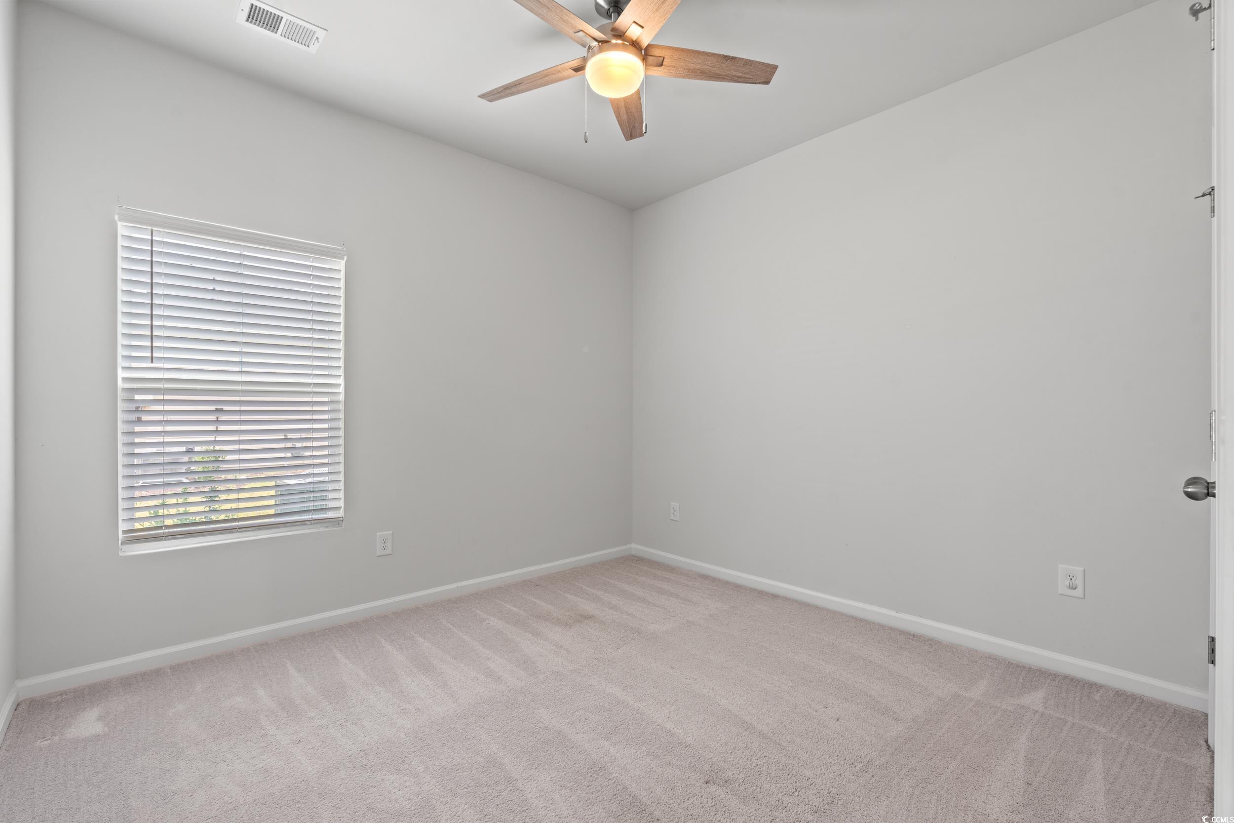 144 Rutland Court Conway, SC 29526 - Photo 15 of 34 Spare room featuring a ceiling fan and light colored carpet
