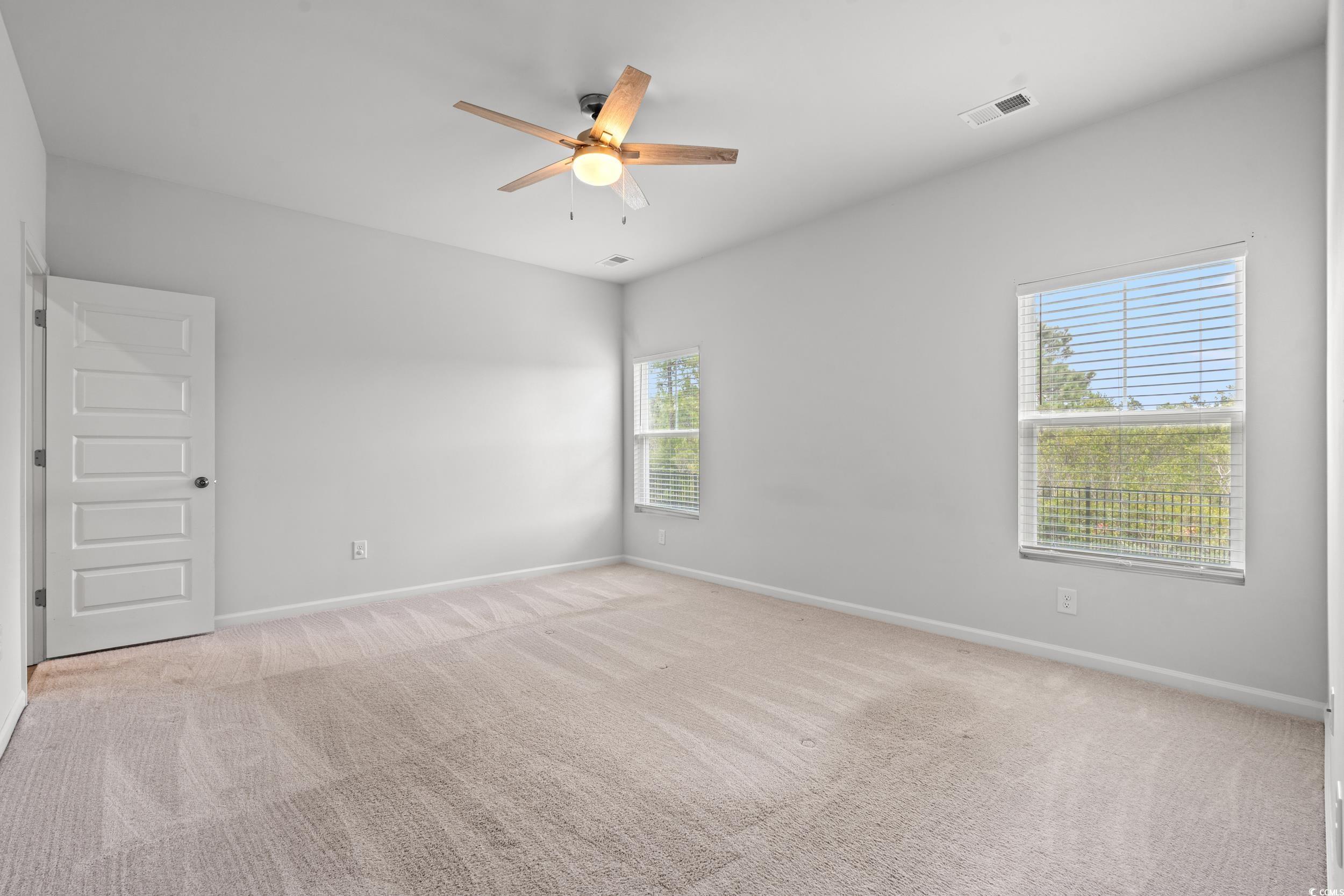 144 Rutland Court Conway, SC 29526 - Photo 9 of 34 Unfurnished room featuring ceiling fan and light carpet