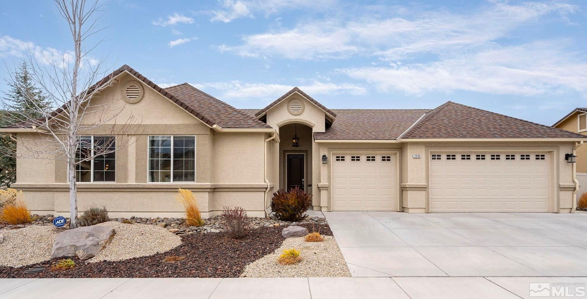 2230 Renzo Way Reno, NV 89521 - Photo 1 of 35 a front view of a house with a yard