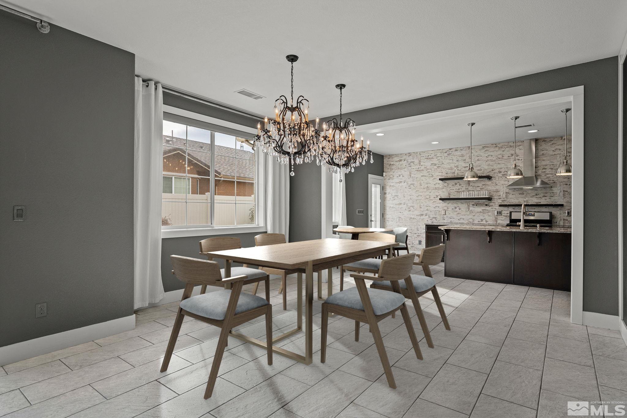 2230 Renzo Way Reno, NV 89521 - Photo 11 of 35 a view of a dining room with furniture and chandelier