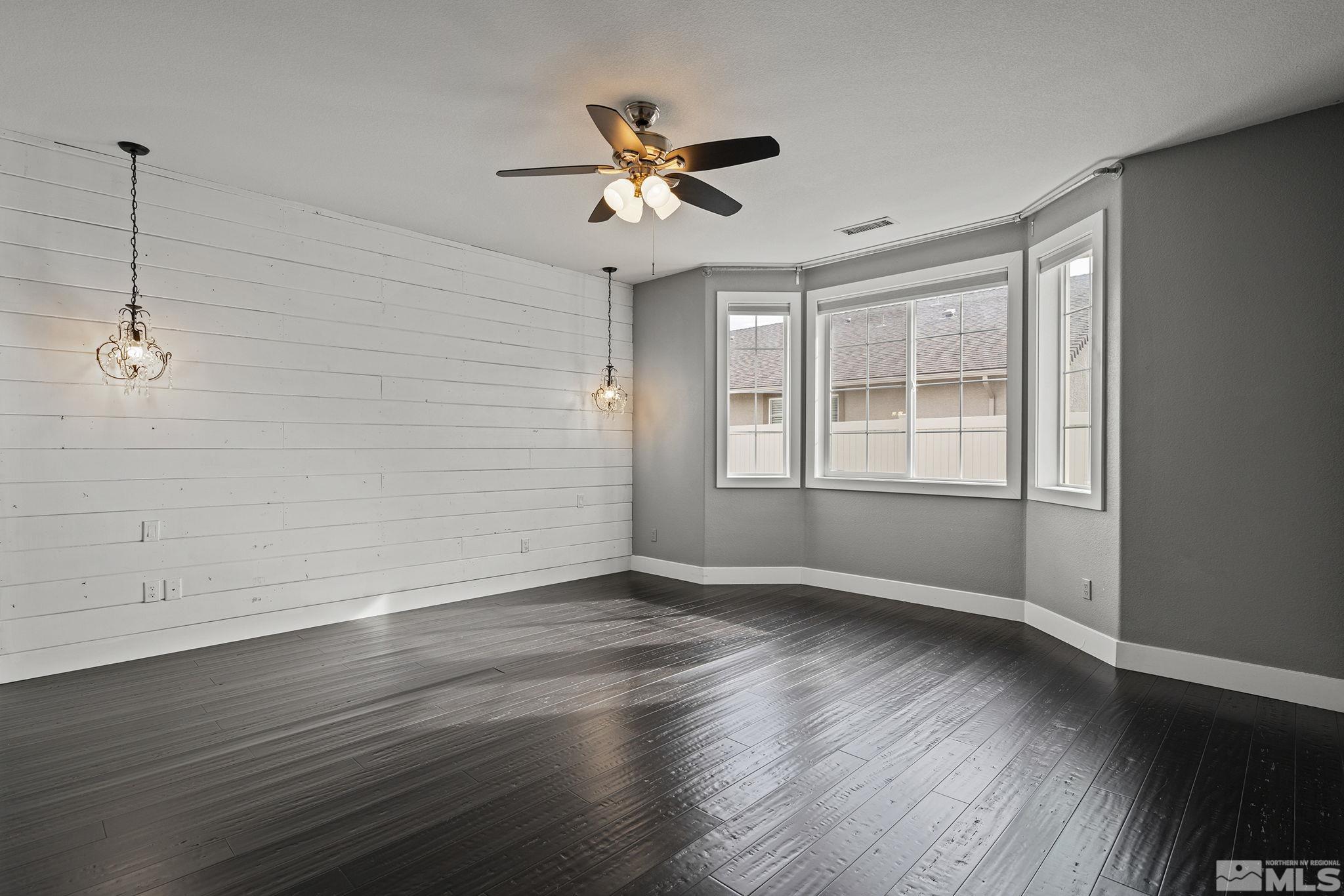 2230 Renzo Way Reno, NV 89521 - Photo 19 of 35 a view of empty room with wooden floor and fan