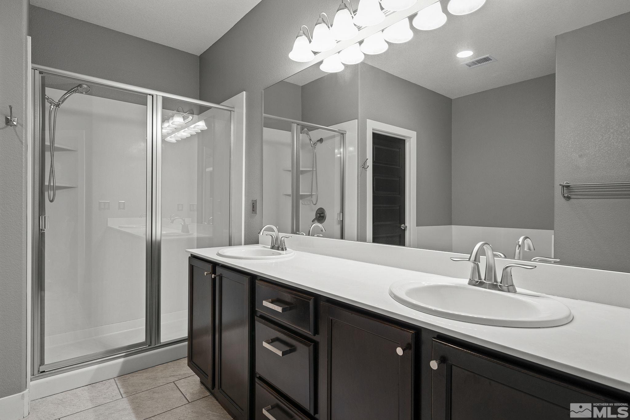 2230 Renzo Way Reno, NV 89521 - Photo 20 of 35 a bathroom with a sink double vanity and a mirror