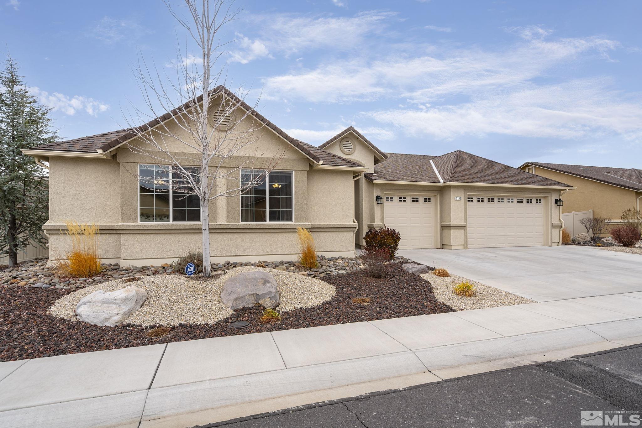 2230 Renzo Way Reno, NV 89521 - Photo 2 of 35 a front view of a house with entertaining space