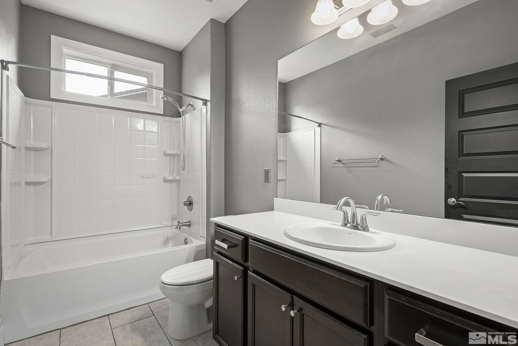 2230 Renzo Way Reno, NV 89521 - Photo 25 of 35 a bathroom with a sink a toilet and shower