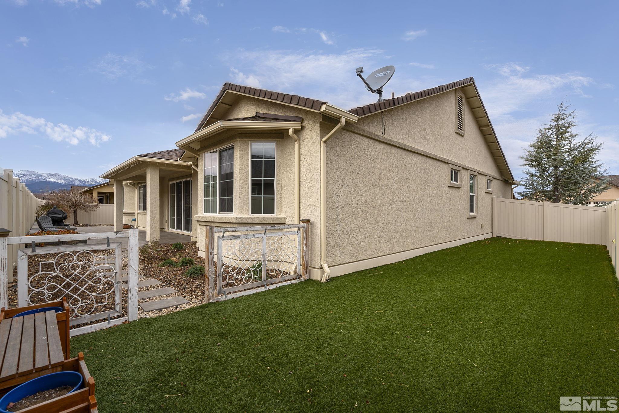 2230 Renzo Way Reno, NV 89521 - Photo 32 of 35 a front view of a house with a garden