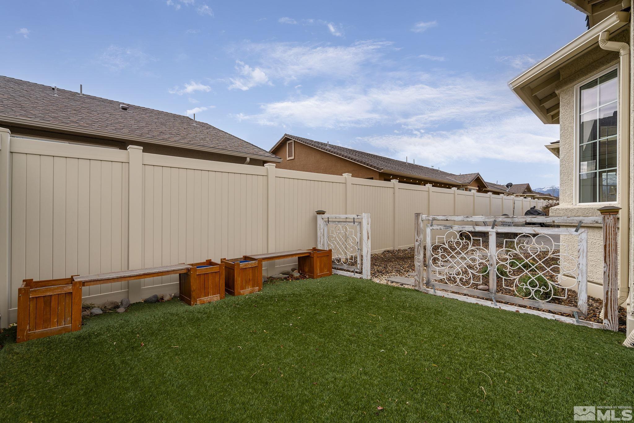 2230 Renzo Way Reno, NV 89521 - Photo 33 of 35 a backyard of a house with table and chairs