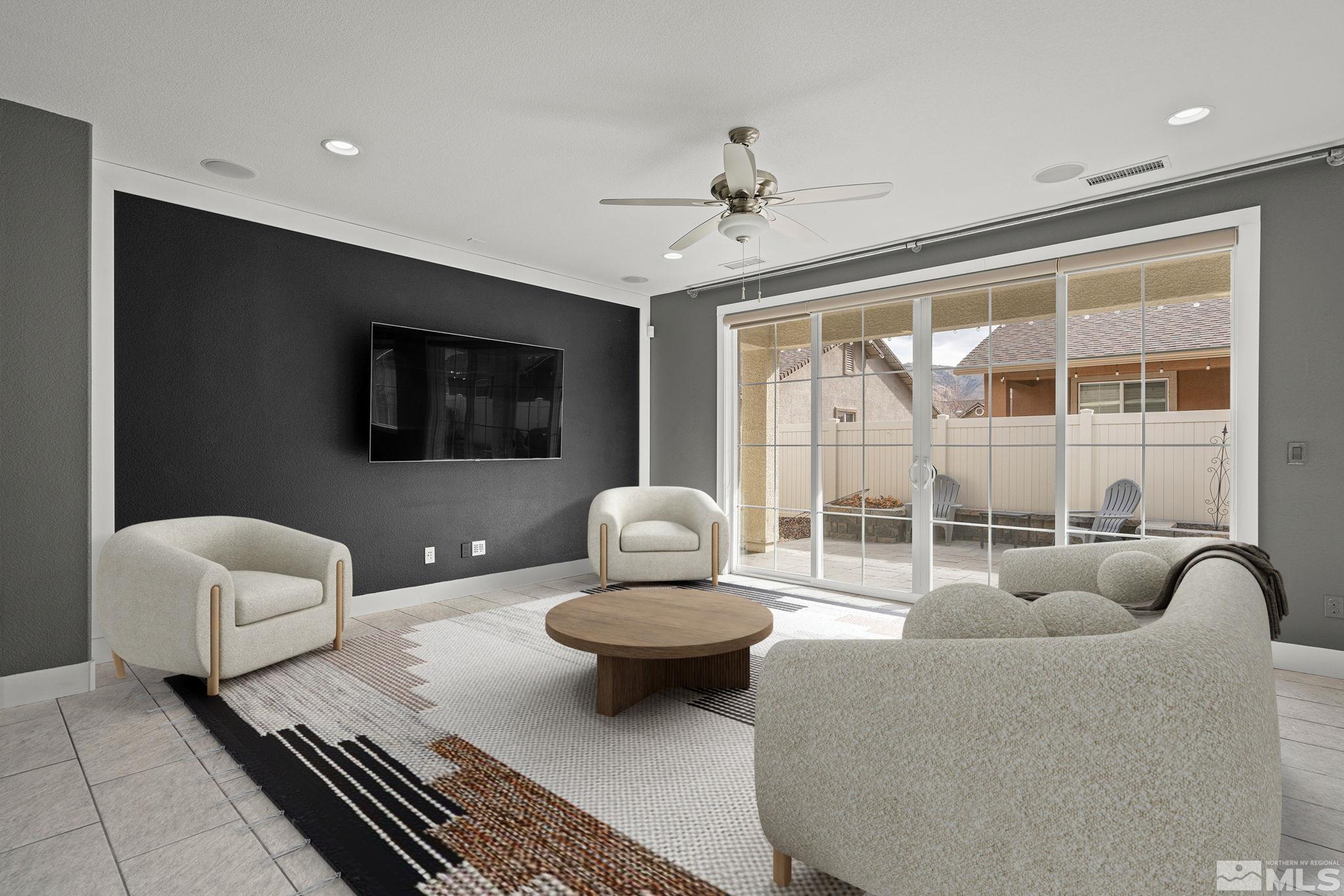 2230 Renzo Way Reno, NV 89521 - Photo 6 of 35 a living room with furniture and a flat screen tv
