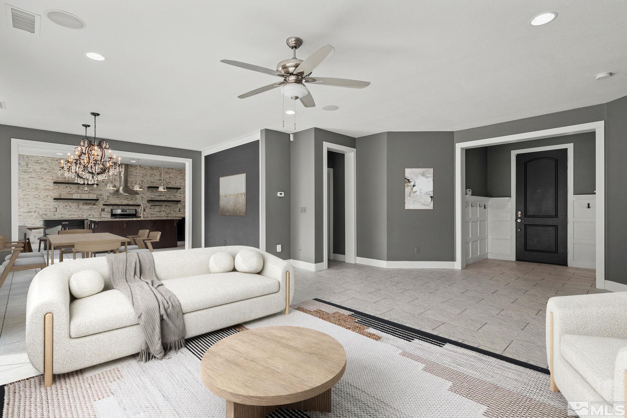 2230 Renzo Way Reno, NV 89521 - Photo 9 of 35 a living room with furniture and a chandelier