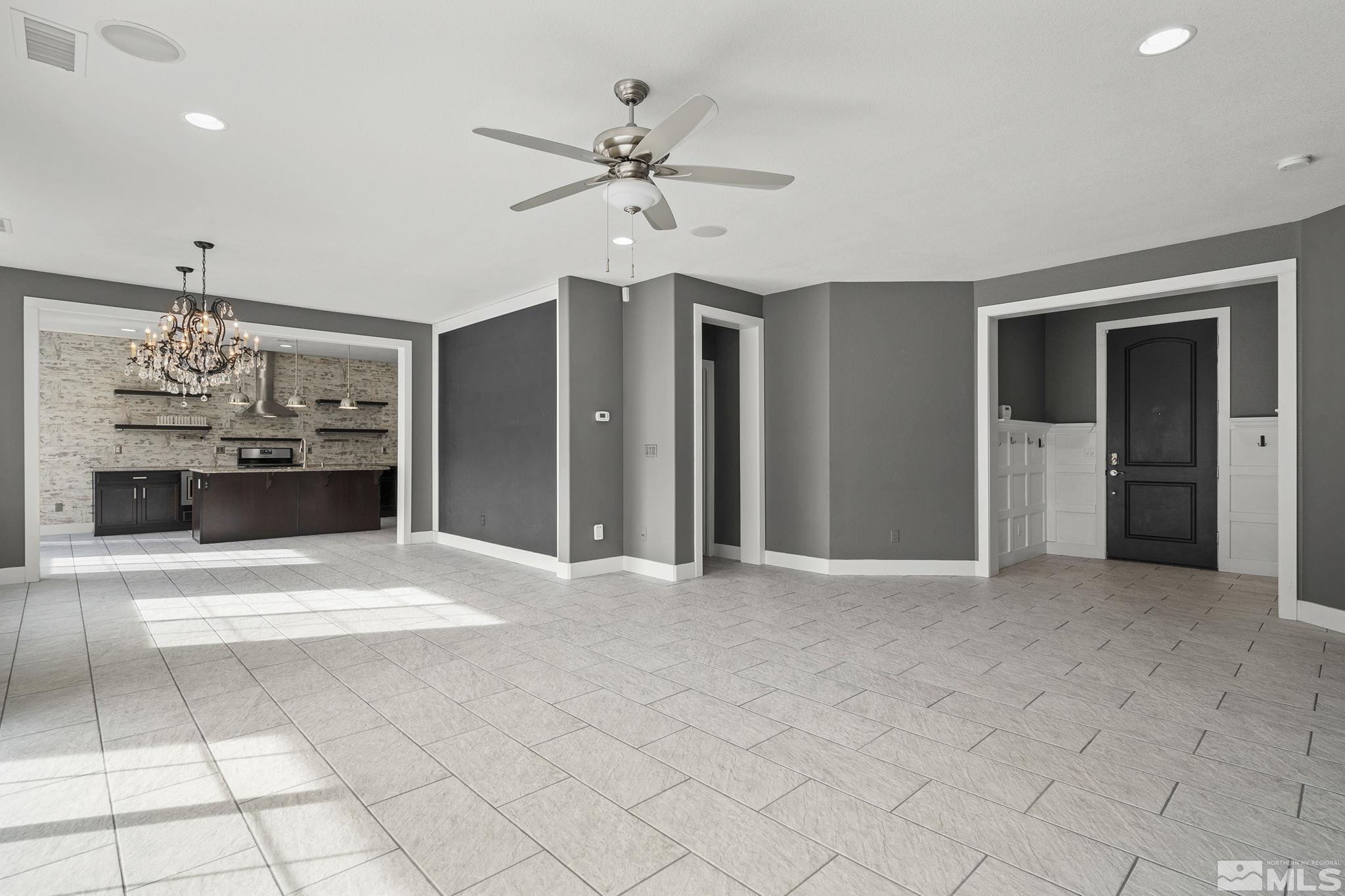2230 Renzo Way Reno, NV 89521 - Photo 10 of 35 a view of livingroom with chandelier fan and kitchen view