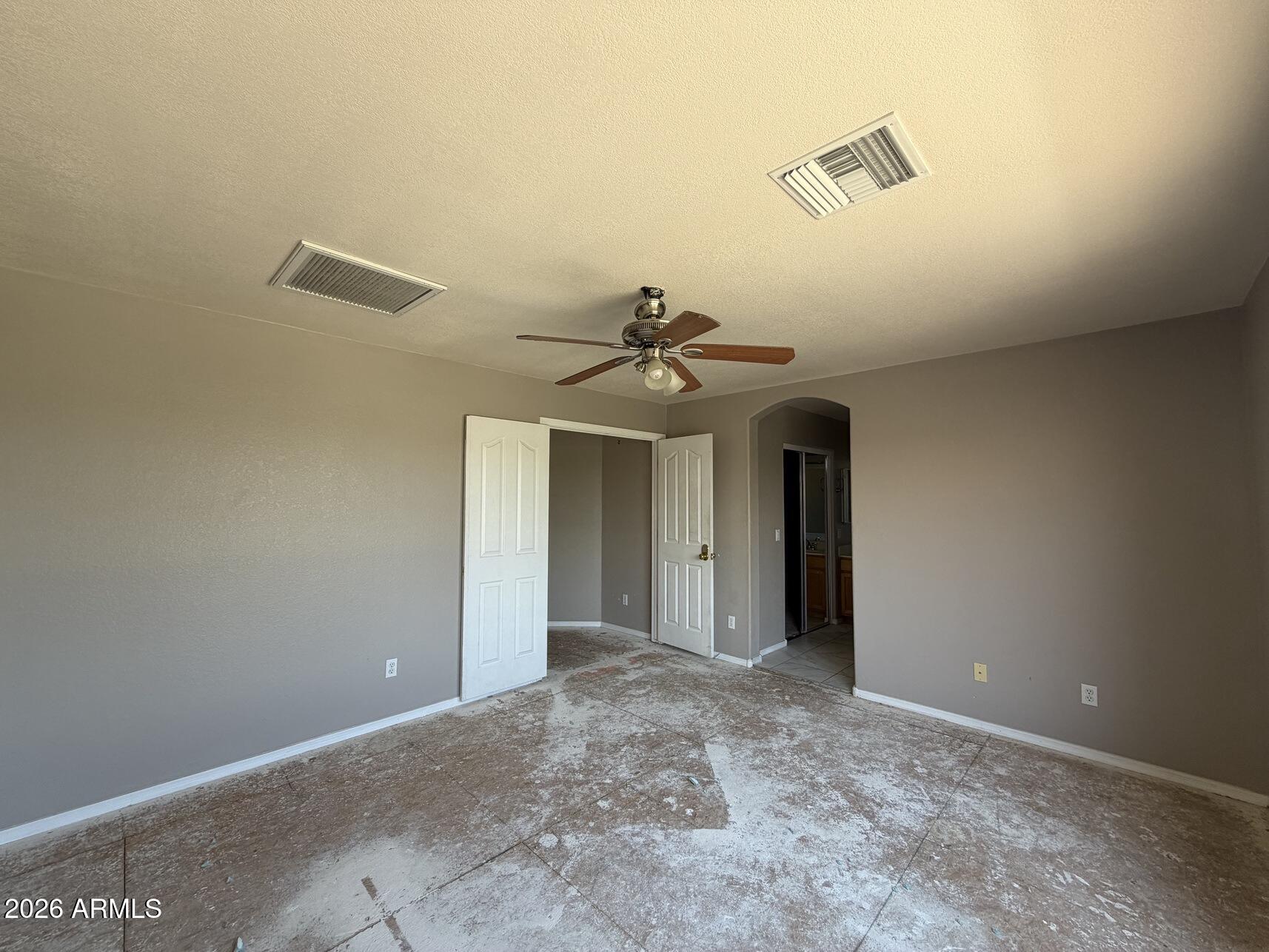 10807 West Monte Vista Road Avondale, AZ 85392 - Photo 28 of 33 a view of a hallway with a ceiling fan