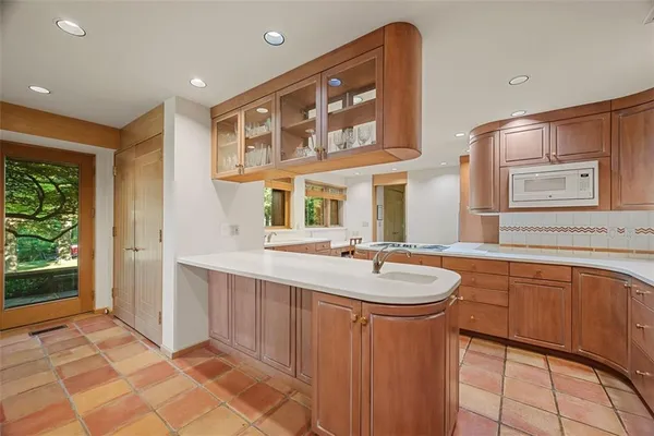 a bathroom with a sink a mirror and a bathtub