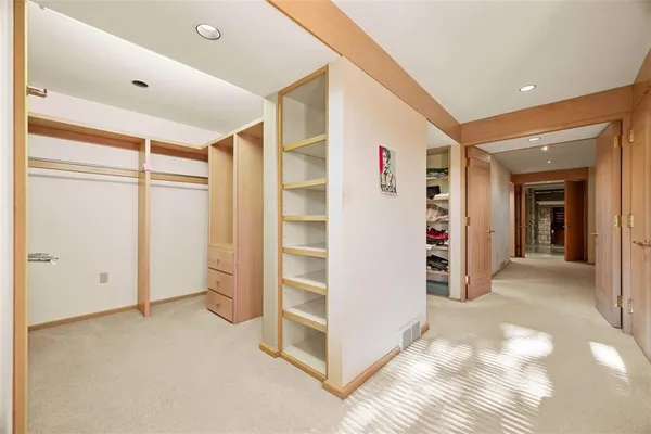 a spacious bathroom with a granite countertop sink mirror and shower
