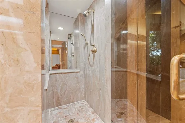 a bathroom with a sink and a large mirror