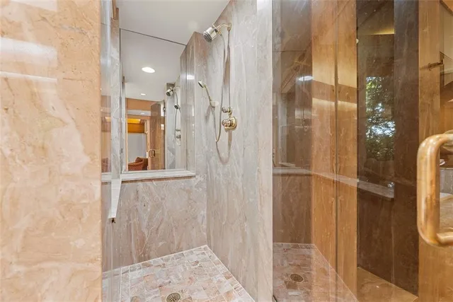 a bathroom with a sink and a large mirror