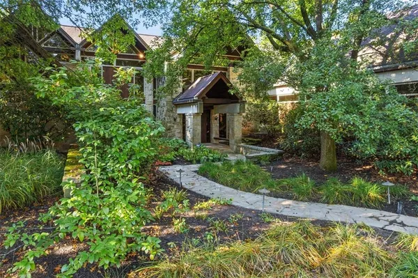 a house with trees in front of it
