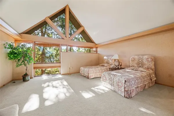 an empty room with windows and mountain view
