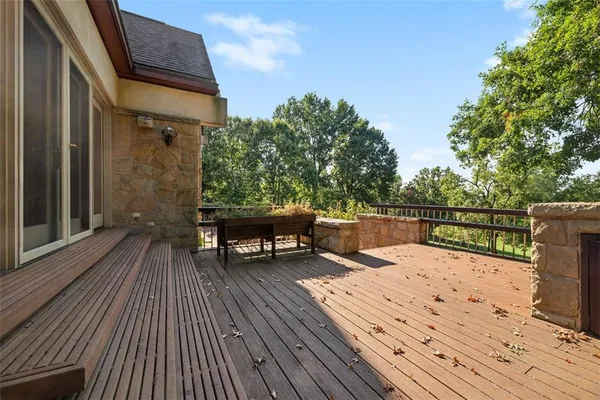 a view of a house with backyard and deck