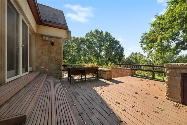 a view of a house with backyard and deck