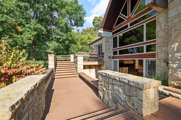 a front view of a house with yard and green space
