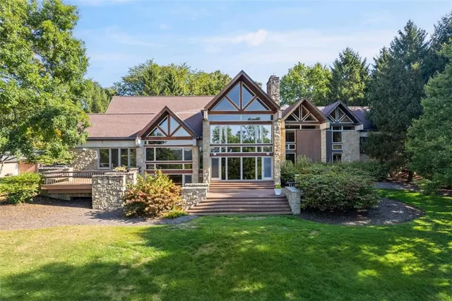 an aerial view of residential house with outdoor space and lake view