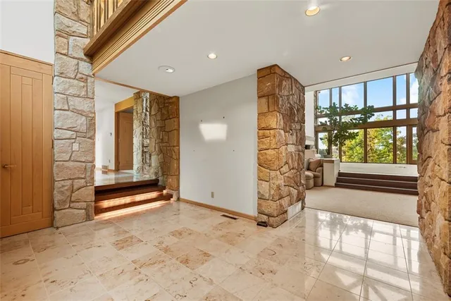 a view of livingroom with furniture and windows