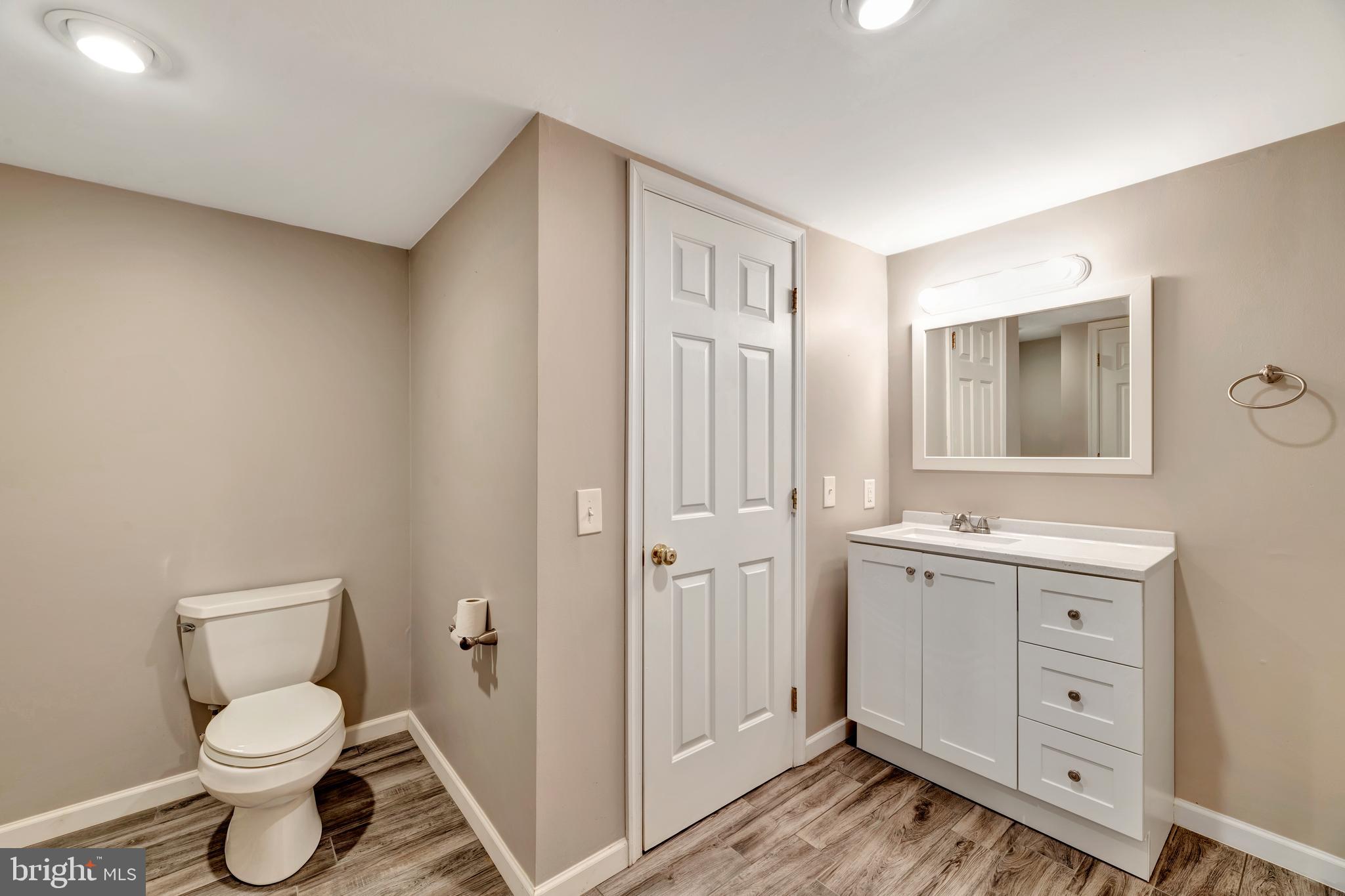 29 Southampton Parish Road Landenberg, PA 19350 - Photo 43 of 56 a bathroom with a toilet a sink a mirror and vanity