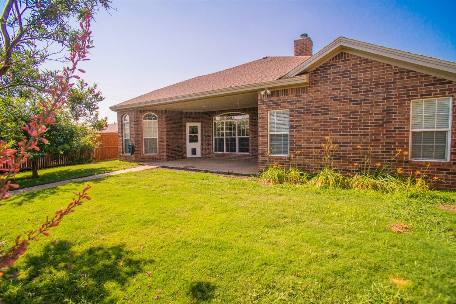5502 103rd Street Lubbock, TX 79424 - Photo 15 of 15 a front view of house with yard and swimming pool