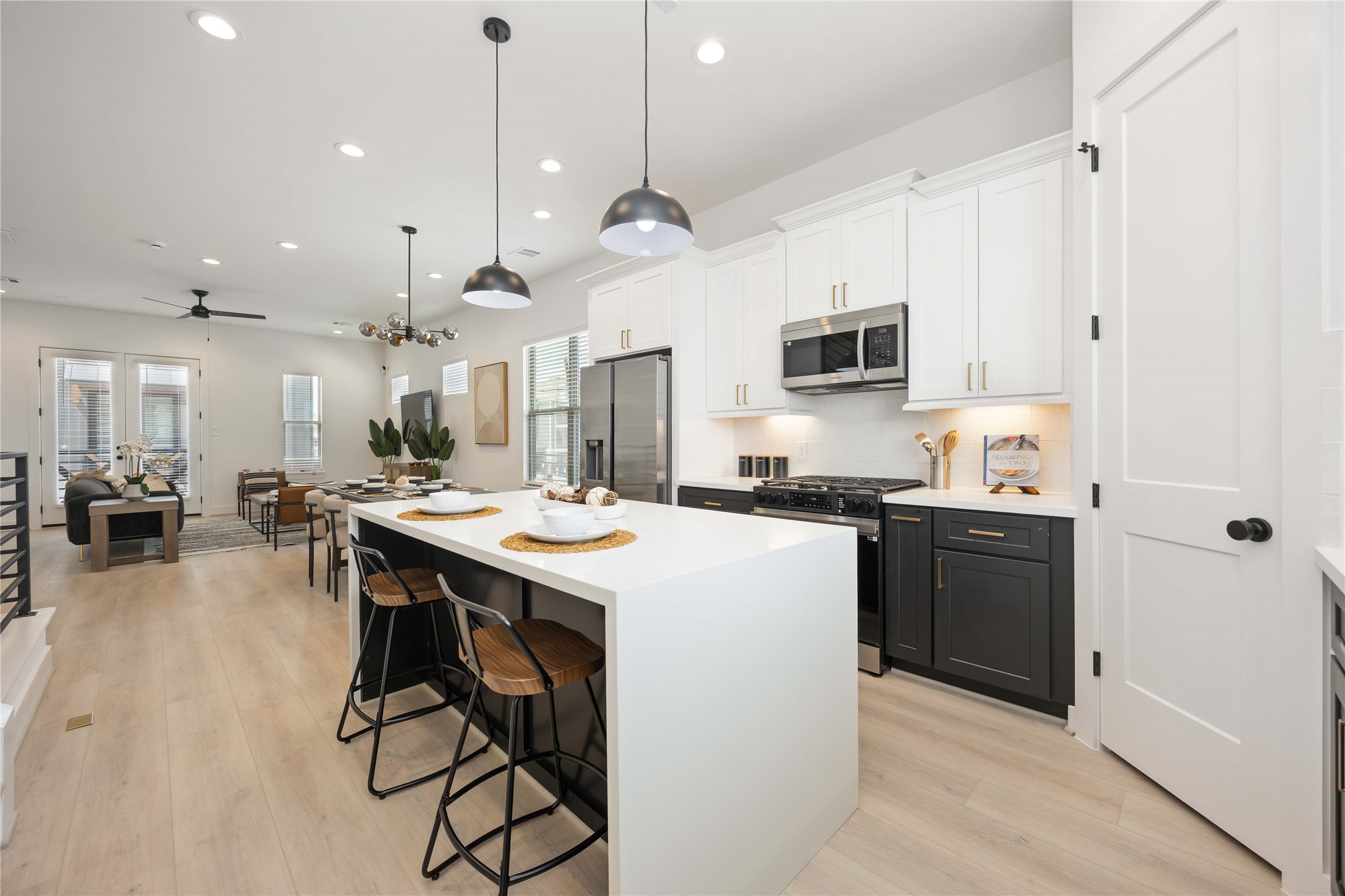 7805 Amelia Road, Unit B Houston, TX 77055 - Photo 13 of 35 Island kitchen. Photo of the model home. Finishes & specifications may vary.