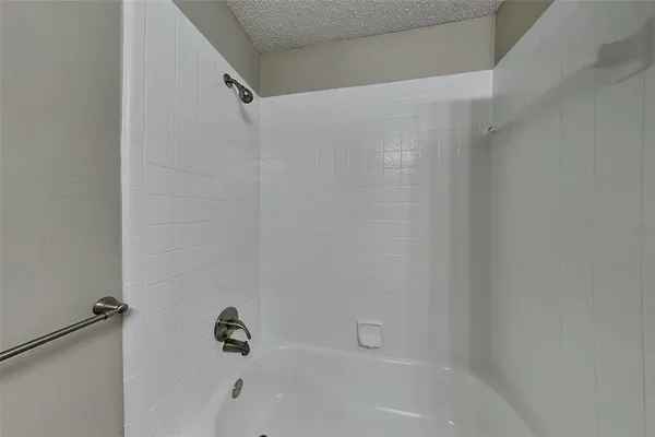 a close up of a bathtub curtain