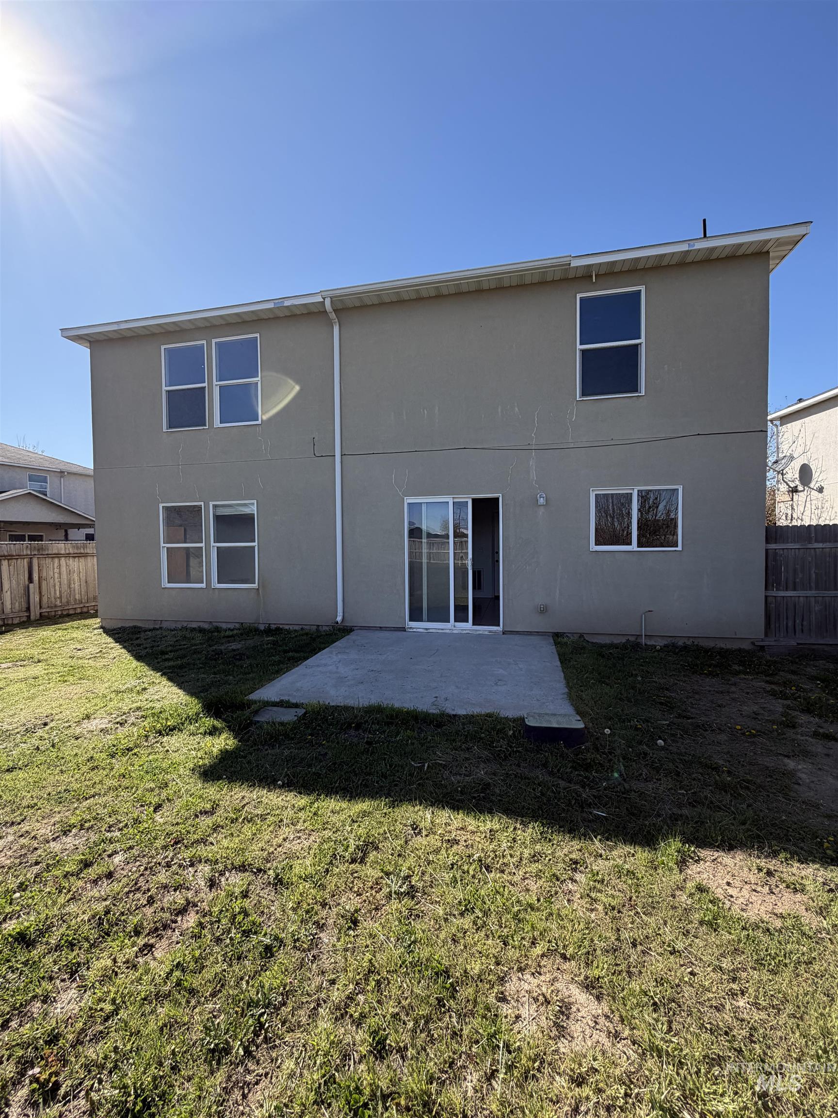 205 Middlepark Way Caldwell, ID 83605 - Photo 17 of 18 Rear view of house with a fenced backyard, a patio area, and stucco siding