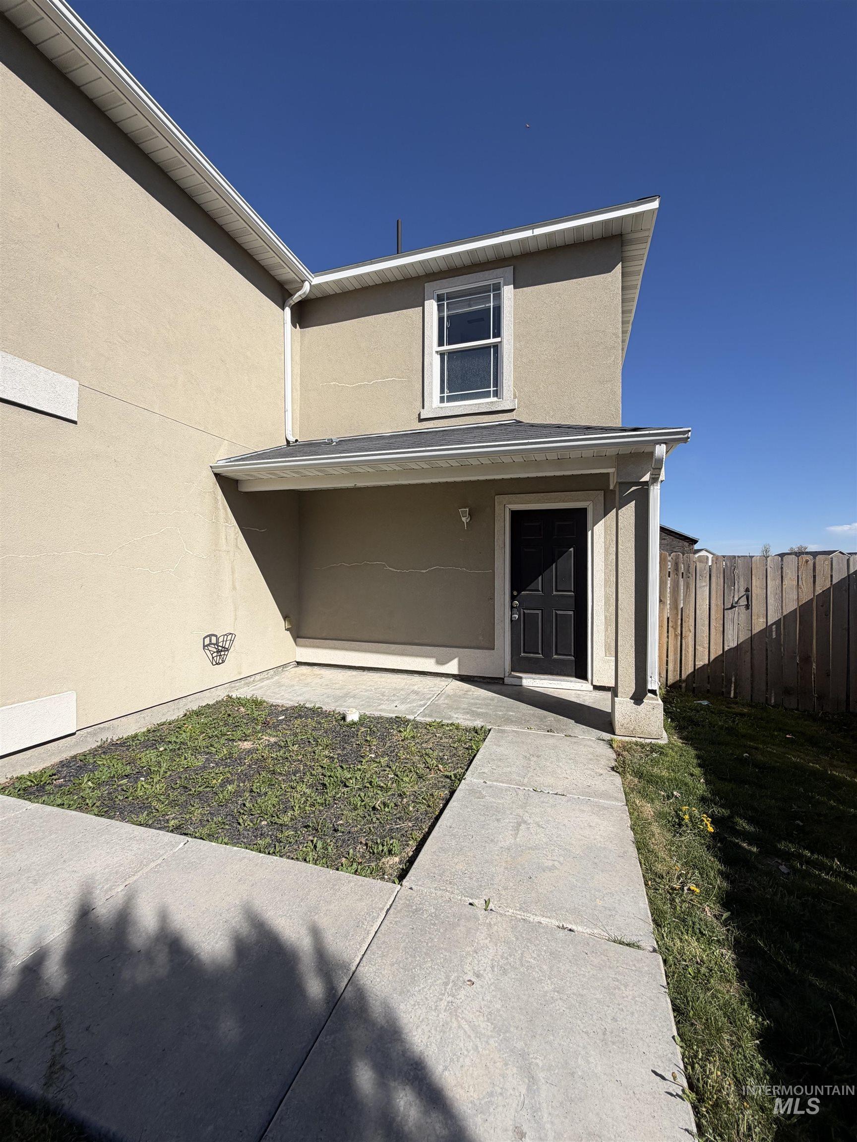 205 Middlepark Way Caldwell, ID 83605 - Photo 2 of 18 Property entrance featuring stucco siding