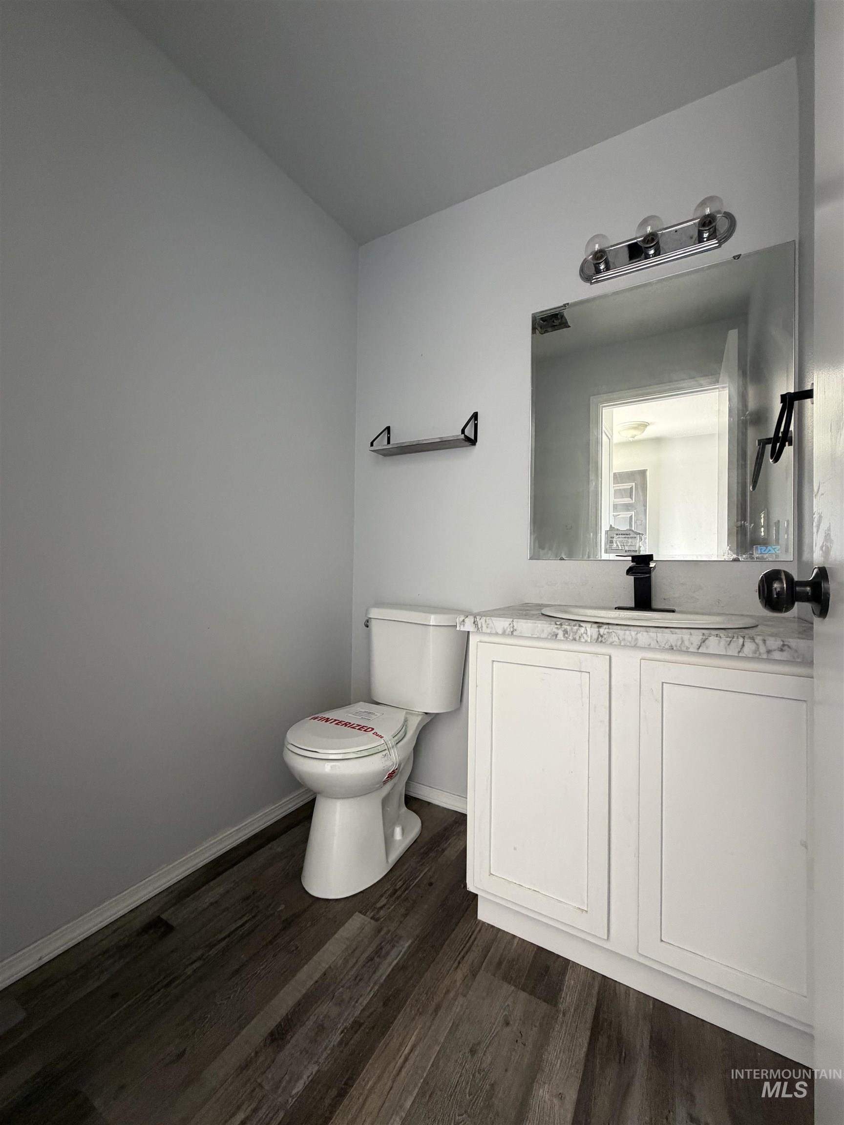 205 Middlepark Way Caldwell, ID 83605 - Photo 4 of 18 Bathroom featuring vanity and dark wood-type flooring