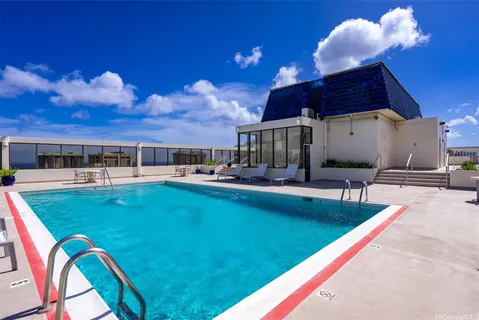 a view of a swimming pool with a patio