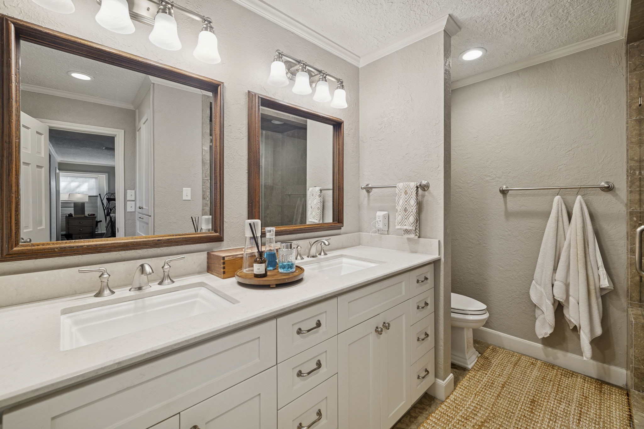 13835 Jarvis Road Cypress, TX 77429 - Photo 13 of 24 a bathroom with a double vanity sink and a mirror