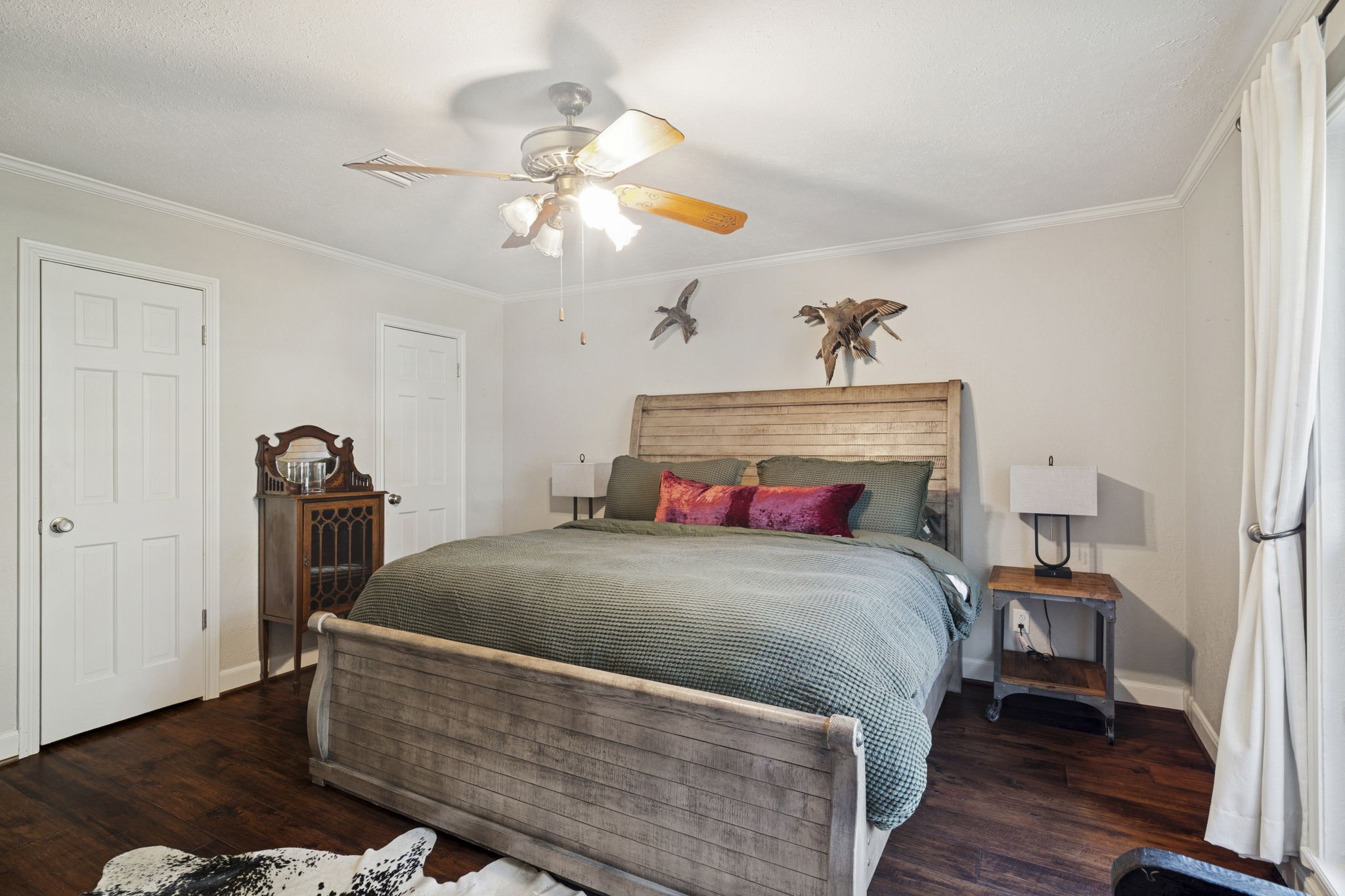 13835 Jarvis Road Cypress, TX 77429 - Photo 14 of 24 a bedroom with a bed and wooden floor