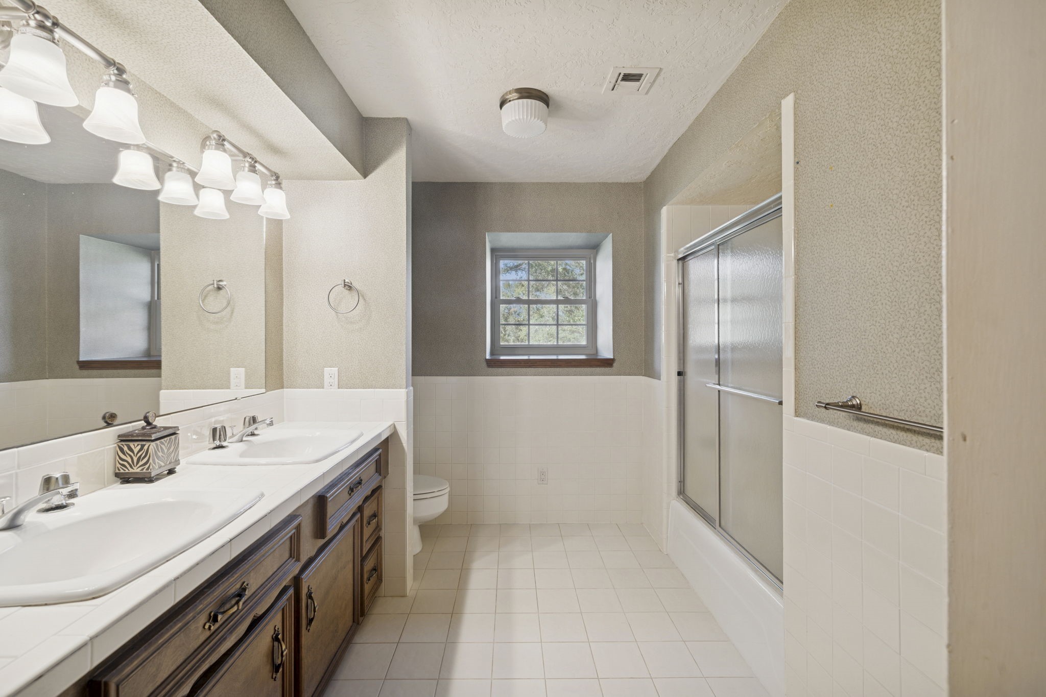 13835 Jarvis Road Cypress, TX 77429 - Photo 18 of 24 a spacious bathroom with a double vanity sink mirror and double