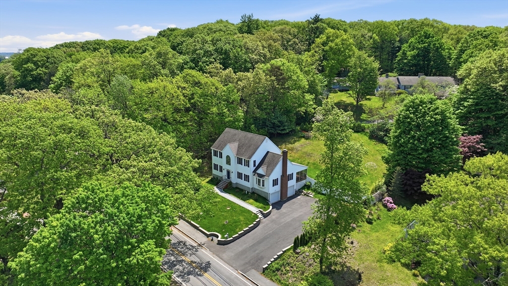 61 Indian Head Road Framingham, MA 01701 - Photo 3 of 42 an aerial view of a house with a garden