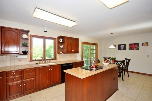 120 West Berlin Road Bolton, MA 01740 - Photo 7 of 29 a kitchen with a sink and cabinets