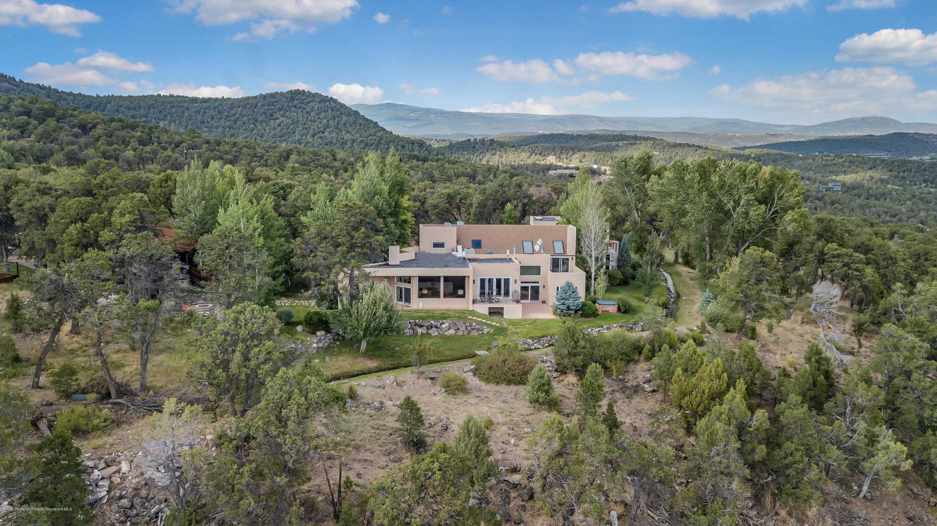 475 County Road 112 Carbondale, CO 81623 - Photo 2 of 53 a view of a big house with a mountain in the background