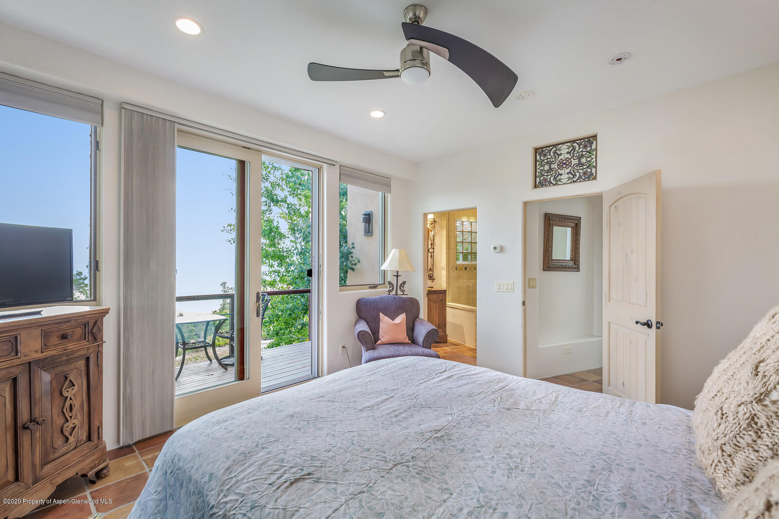 475 County Road 112 Carbondale, CO 81623 - Photo 44 of 53 a bedroom with a large bed and a flat tv screen