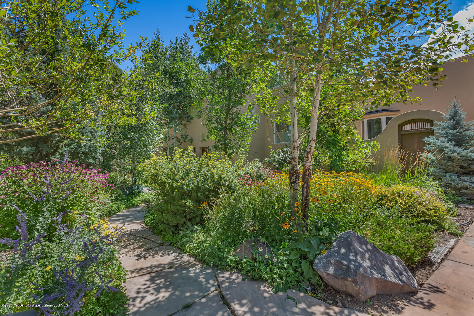 475 County Road 112 Carbondale, CO 81623 - Photo 7 of 53 a view of a garden with plants and large trees