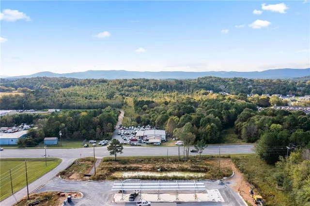 a view of a swimming pool with a yard