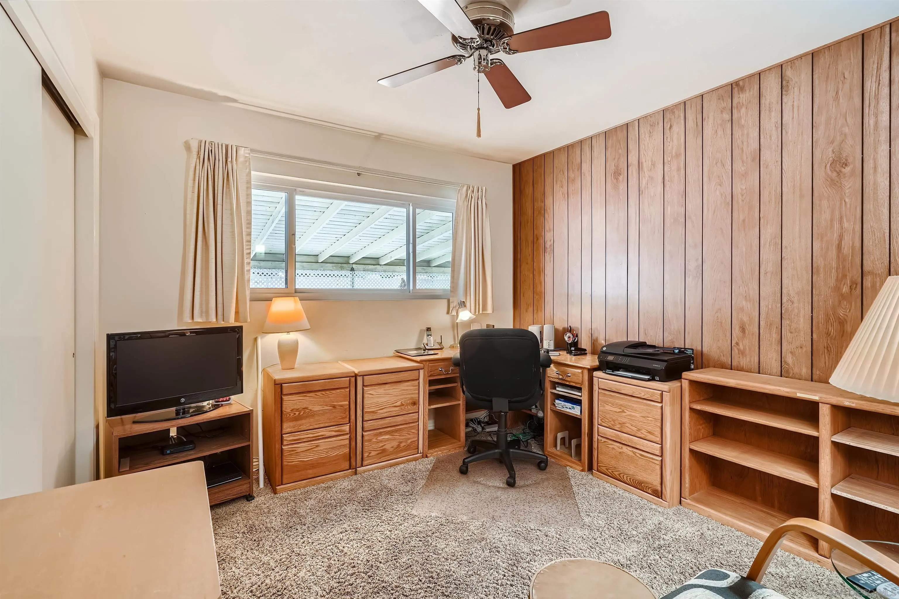 577 Cedar Street El Cajon, CA 92021 - Photo 9 of 11 a view of a workspace with furniture and a window