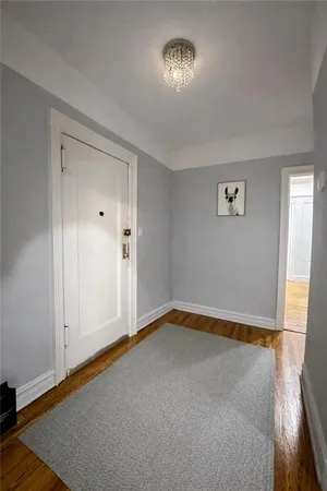 an empty room with a empty space and a window