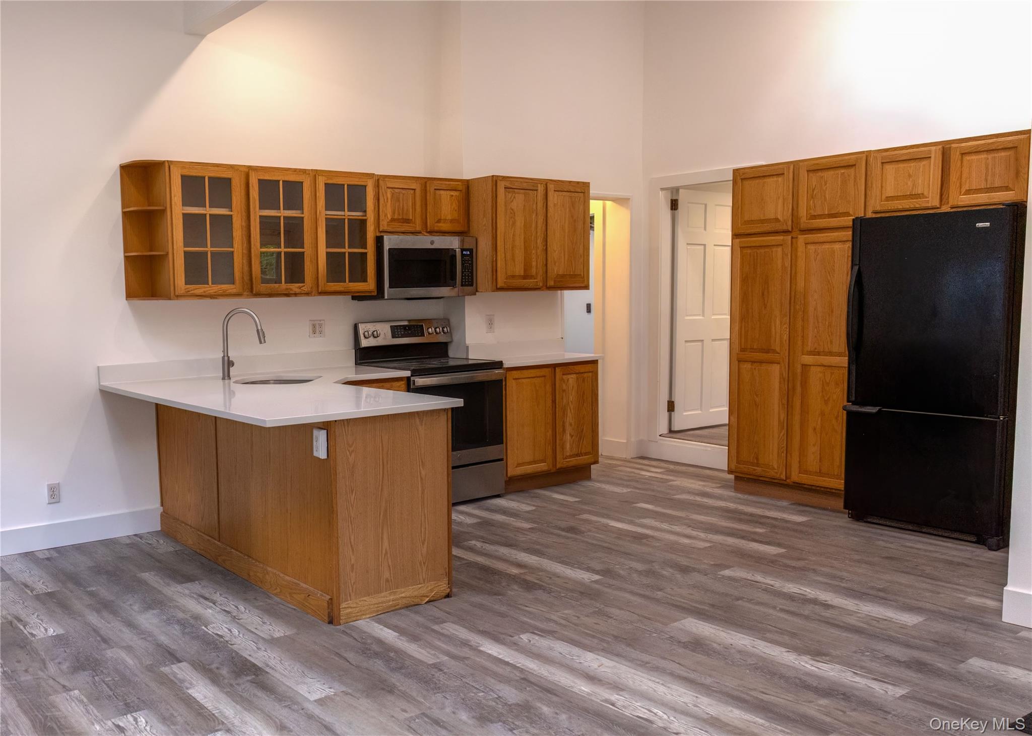 23 Lucille Road Carmel, NY 10512 - Photo 6 of 44 a kitchen with stainless steel appliances granite countertop a refrigerator and a stove
