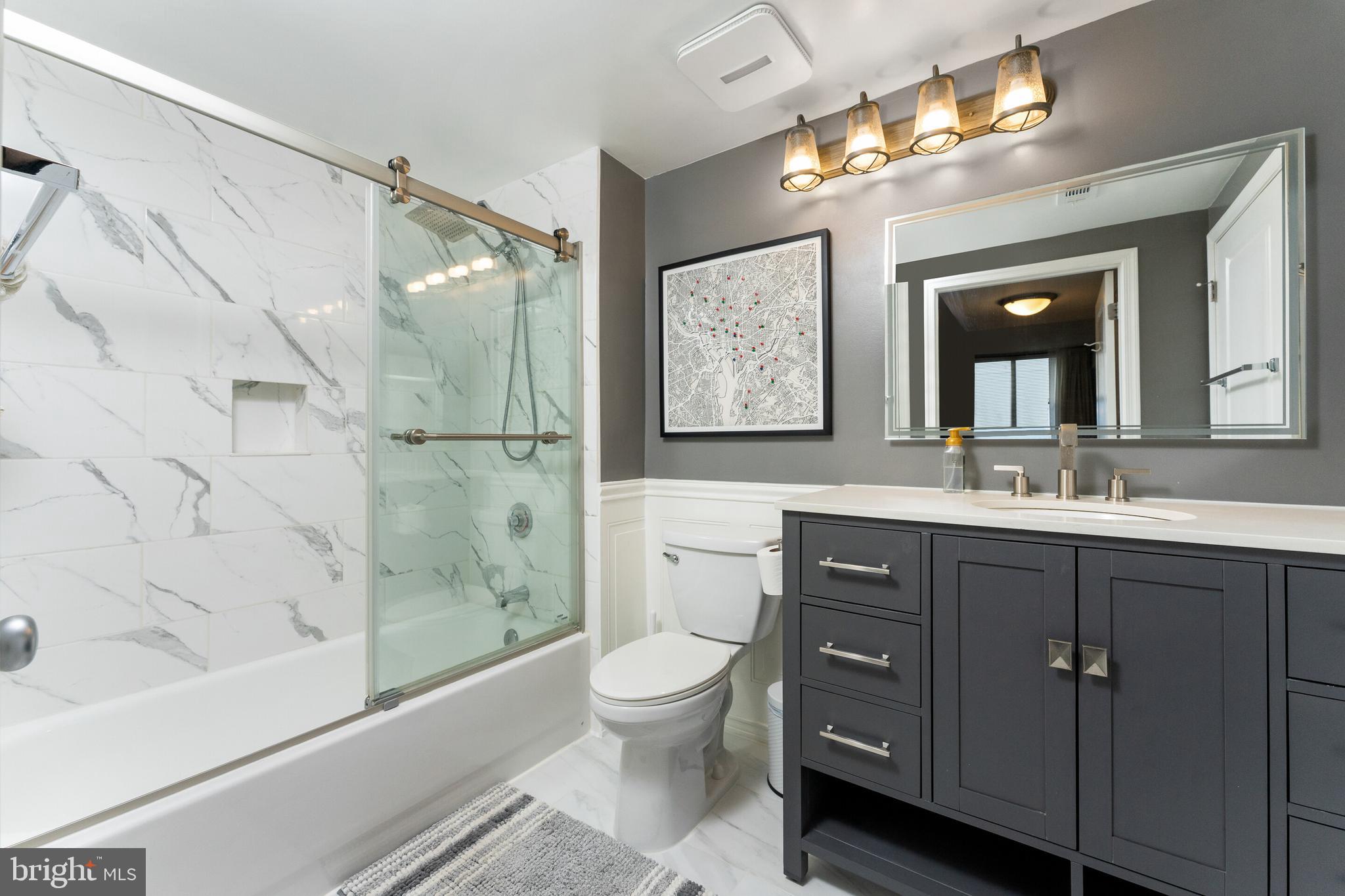 851 North Glebe Road, Unit 1818 Arlington, VA 22203 - Photo 11 of 23 a bathroom with a toilet a sink and bathtub