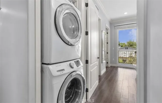 a view of a hallway with washer and dryer