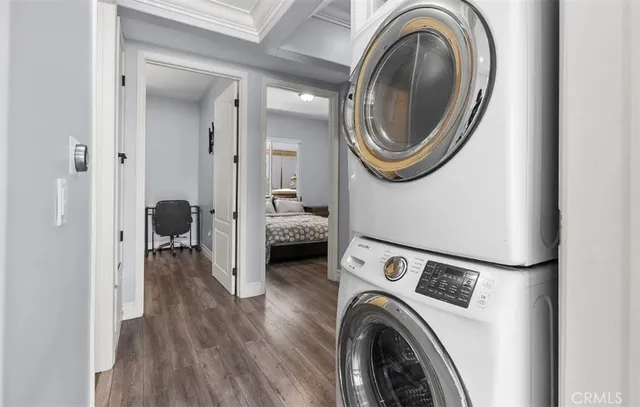 a view of a hallway with washer and dryer