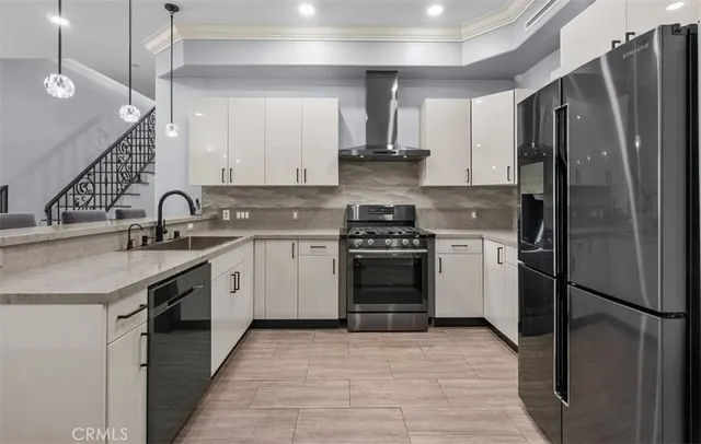 a kitchen with a sink stove and refrigerator