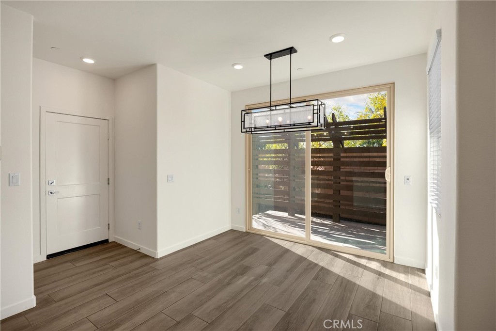 2323 Apple Upland, CA 91786 - Photo 17 of 57 a view of a room with wooden floor and window